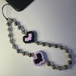 Cell phone wristlet from The Charm Hut works on any phone case